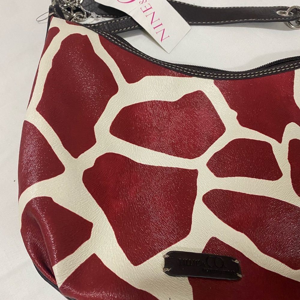 NWT Red and Cream Color with Brown Interior.